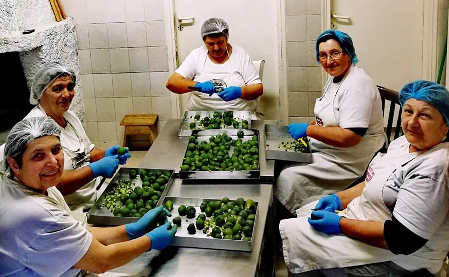 women around the table peeling lemons at 'Agios Antonios Women’s Agri Cooperative